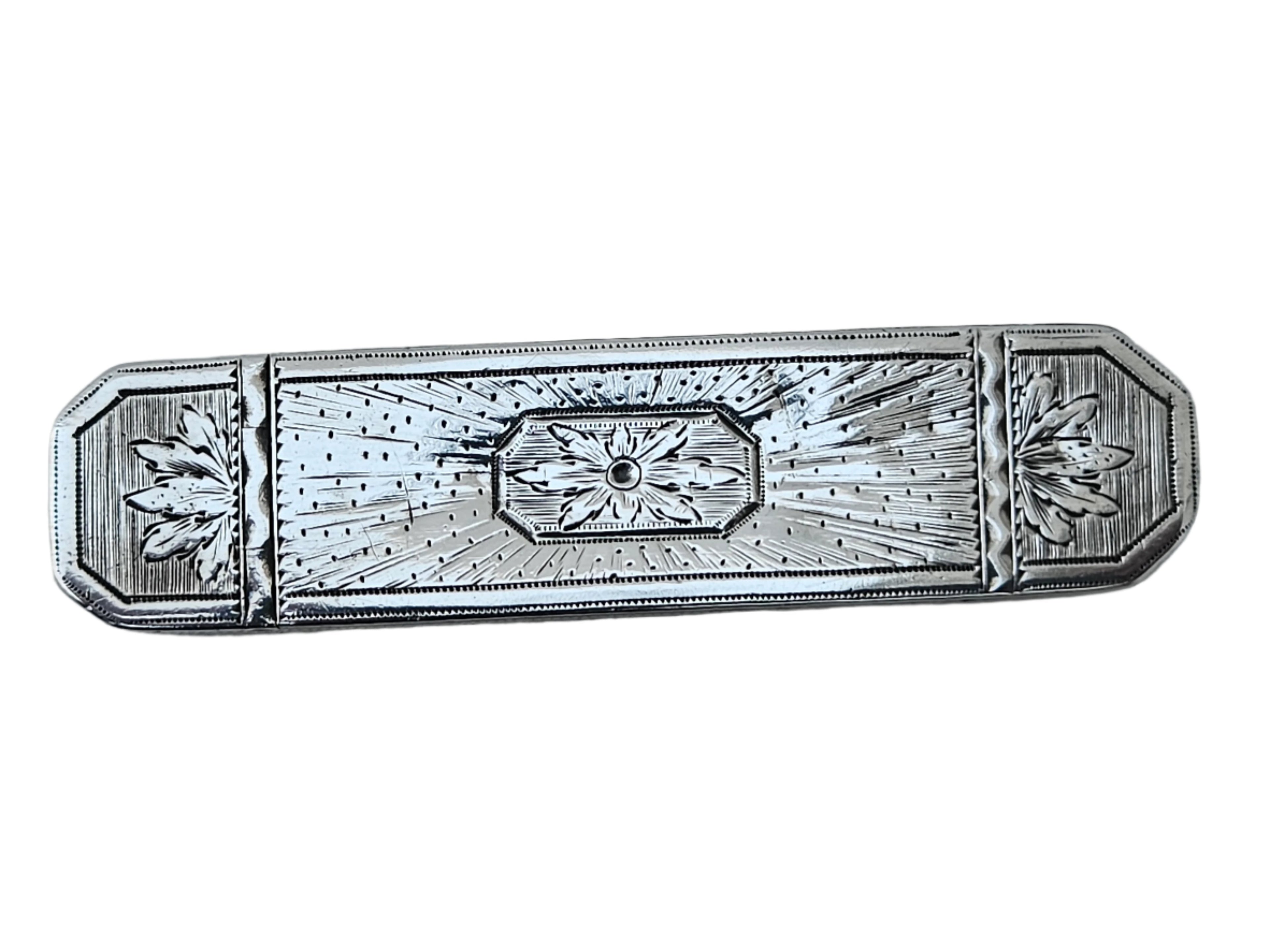 A finely crafted English toothpick box from the late 18th century by Samuel Pemberton, made of sterling silver and featuring engraved floral patterns with a central geometric motif, displayed on a smooth marble surface.