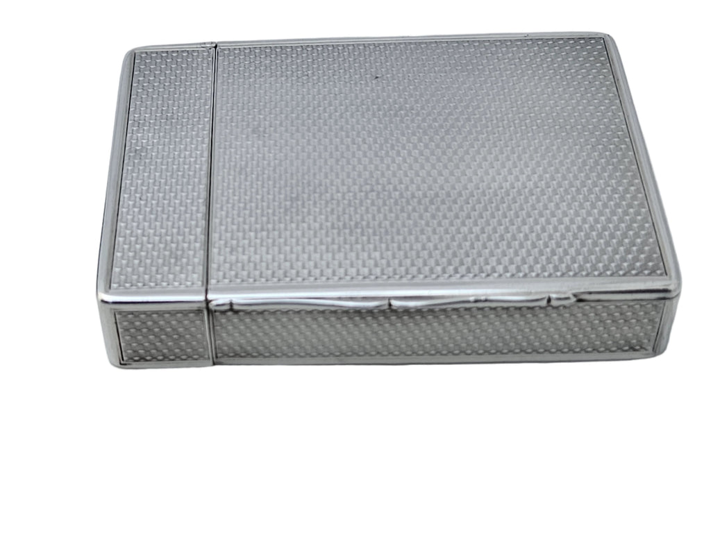 A STERLING SILVER 19TH CENTURY ANTIQUE ENGLISH SNUFF BOX & CALLING CARD CASE by SEVENTH PLATEAU, featuring a textured pattern, resting on a white surface.