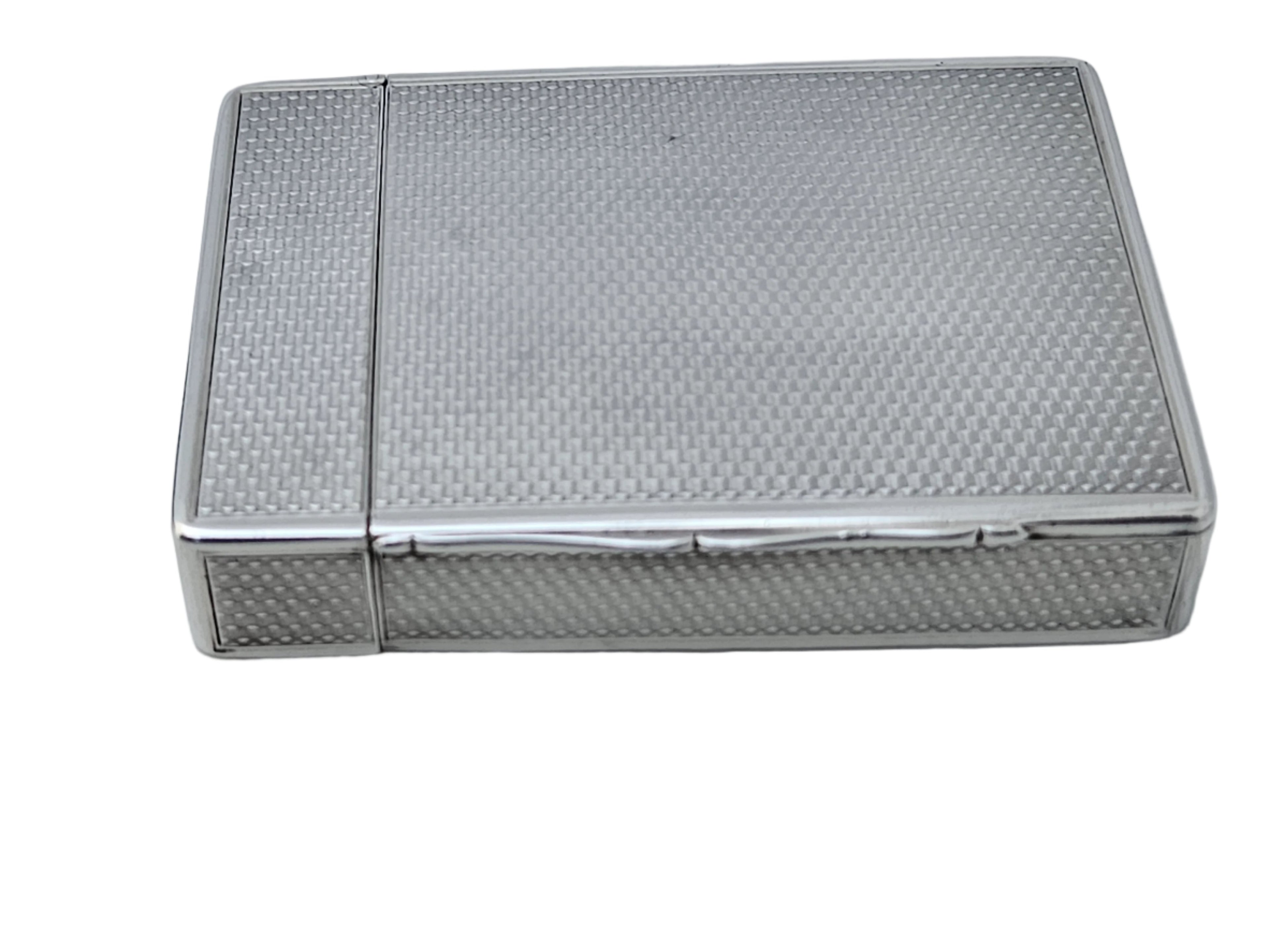 A STERLING SILVER 19TH CENTURY ANTIQUE ENGLISH SNUFF BOX & CALLING CARD CASE by SEVENTH PLATEAU, featuring a textured pattern, resting on a white surface.