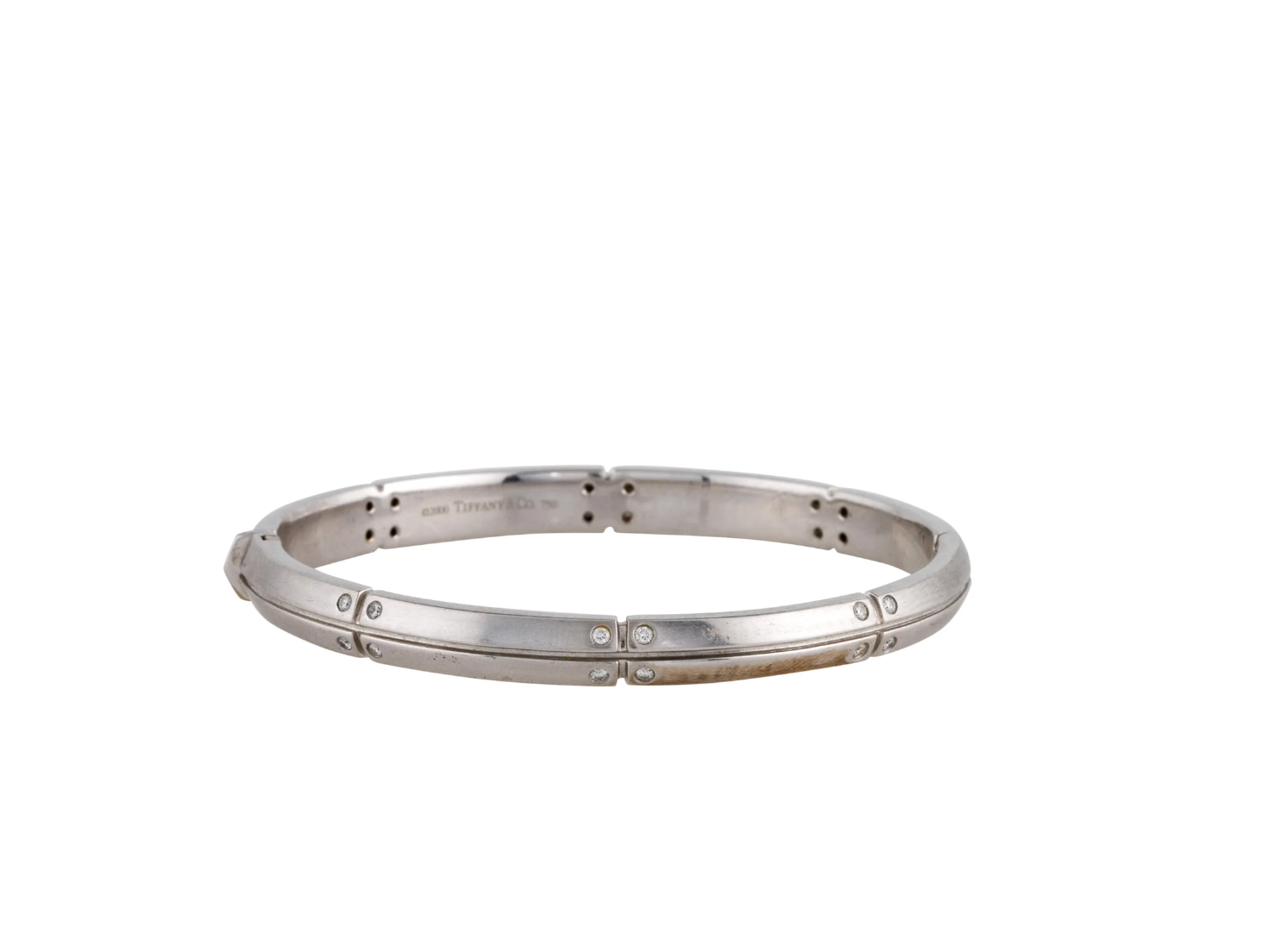 TIFFANY AND CO. 18K WHITE GOLD AND DIAMOND STATION HINGED BANGLE BRACELET