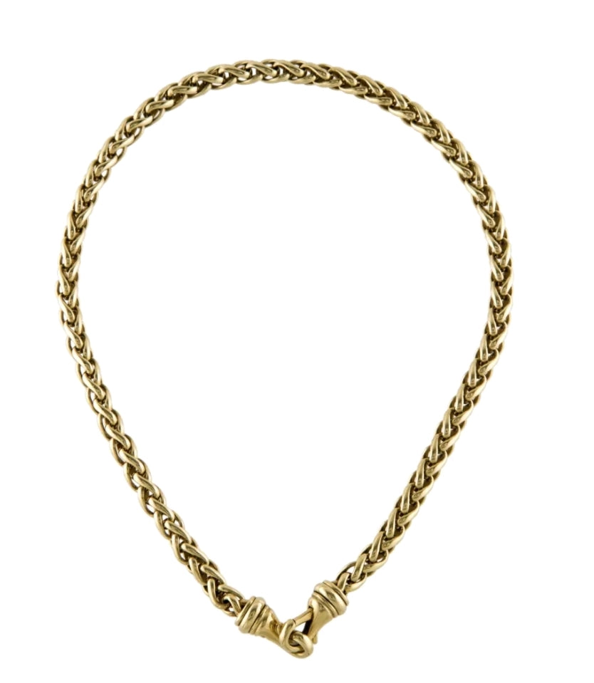Introducing the DAVID YURMAN 18K YELLOW GOLD WOVEN WHEAT CHAIN NECKLACE by seventhplateau. This stunning gold necklace features an intricately woven wheat chain design. The ends meet at a clasp with a loop and knot detail, embodying the designer's signature touch. Crafted from 18K yellow gold, this piece exudes an elegant and timeless style.